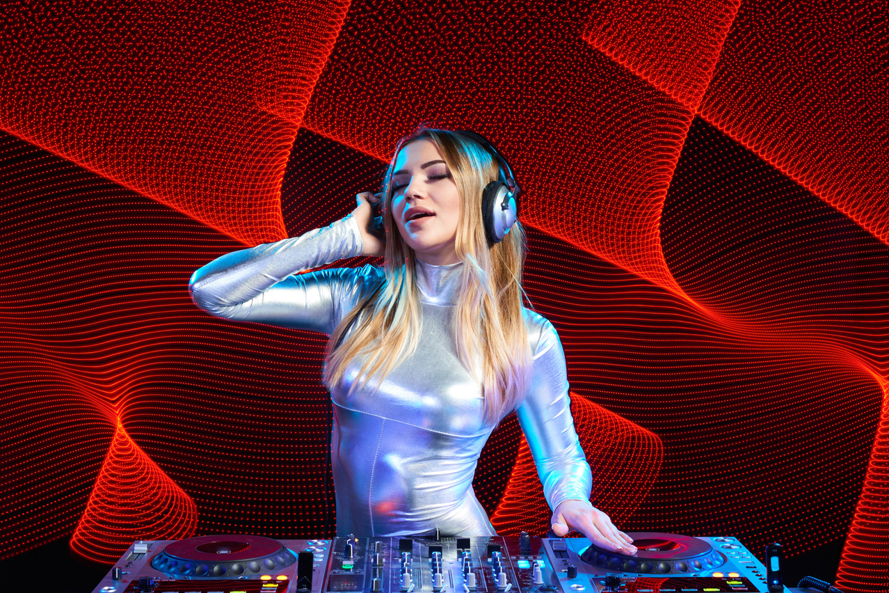 DJ girl on decks at the party
